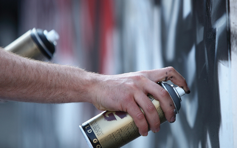 Spray painting graffiti